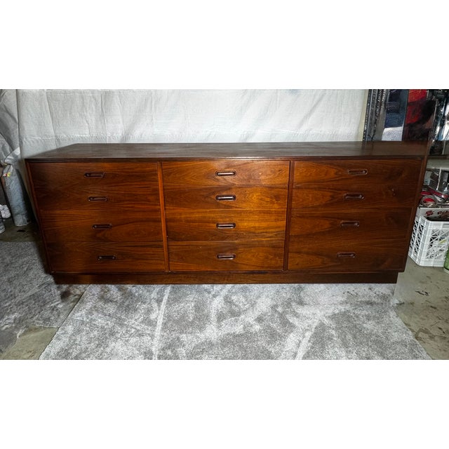 Mid Century Walnut Dressers Attributed to Jack Cartwright by Founders. Beautiful Solid Walnut with sculpted walnut pulls...