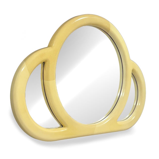 This beautiful, expressive wall mirror by the Turner Mirror Co. has three circular forms in a soft cloverleaf form. The...