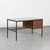 An elegant modernist desk, model 620, designed by Pierre Guariche and produced by Minvielle in the 1950s. The square-...