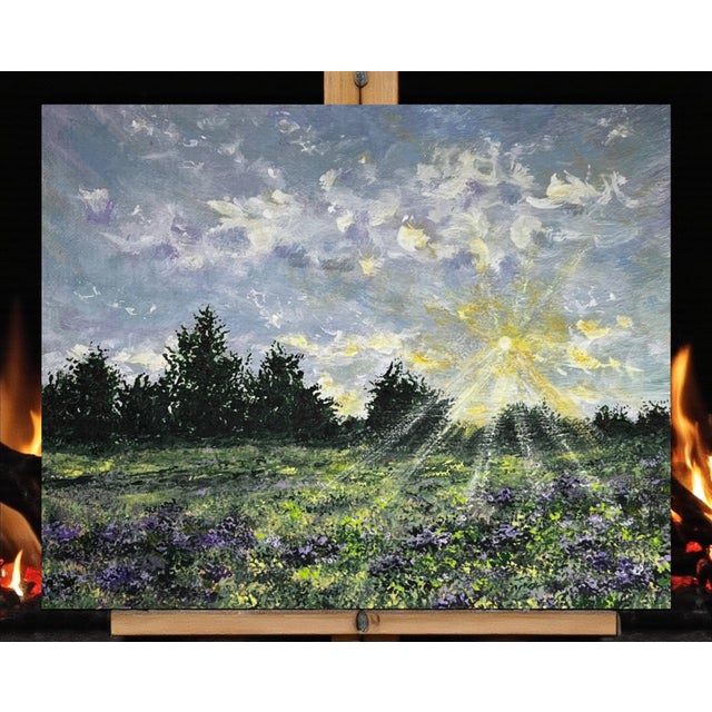 The radiant sunlight filters through clouds, illuminating a serene field of purple wildflowers. This calming original...