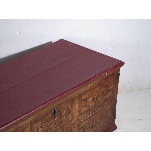 This antique solid pine wood trunk from Central Europe, dating to c.1900 represents the practical domestic furniture...