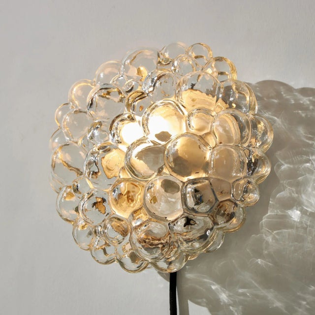 Bubble glass wall light from the 1960s designed by Helena Tynell for Limburg. with some wear and rust on the metal parts....