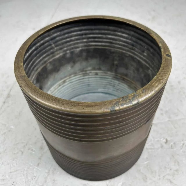 Antique ribbed copper hibachi decorated with a simple water landscape featuring palms and birds. Hibachi were originally...