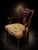 An elegant late 19th-century mahogany open armchair distinguished by its finely carved and pierced back, graceful...