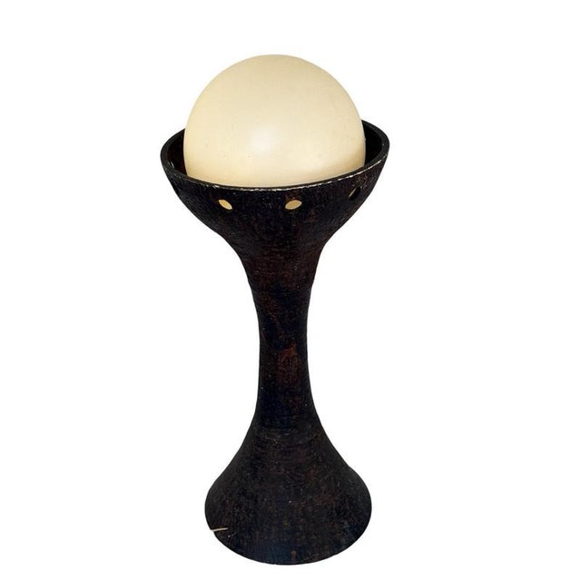 This exquisite floor lamp by is a remarkable statement piece made entirely from ceramic. Standing tall at 95cm, its...
