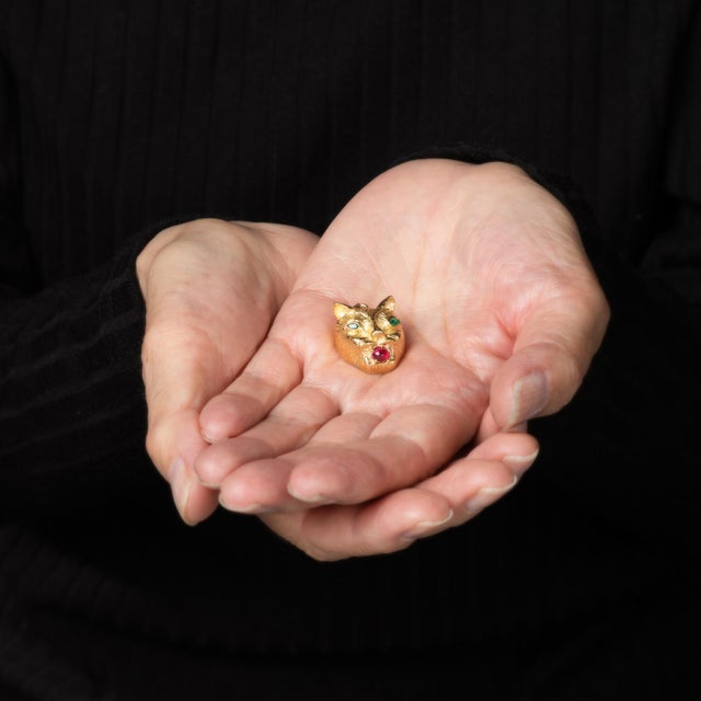 Unique & stylish vintage panther pendant crafted in 14 karat yellow gold (circa 1980s to 1990s). Two small marquise cut...