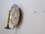 This sconce has a mirrored backplate that measures 11.5" Diameter.