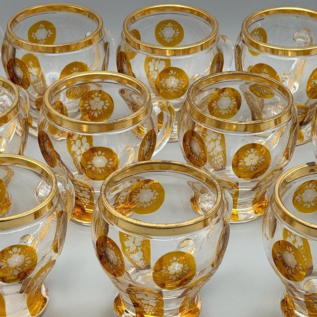 A set of twelve glasses attributed to Harrach. Excellent condition with no chips or defects. Dimension: H 8cm Diameter of...
