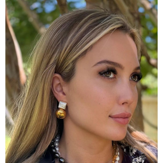 Natural mother of pearl paired with a pop of gold