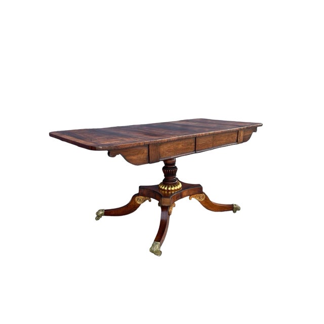 A very fine early 19th century Regency sofa table, beautifully hand carved and of gorgeous quality with rich patination...