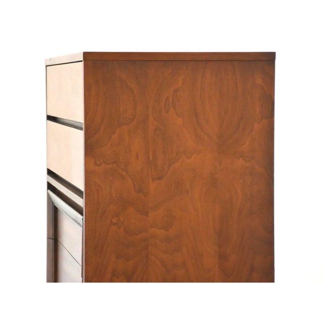 A mid century modern walnut tall dresser made by Basic Witz. 38” wide. 19” deep. 45” tall.