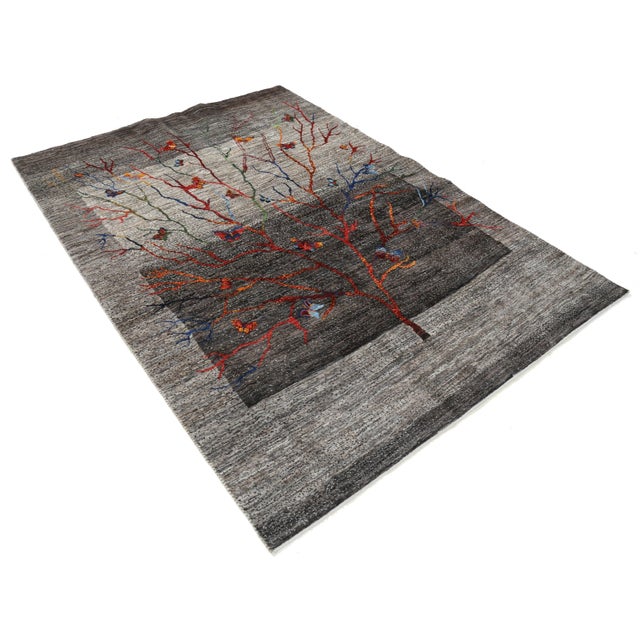 Gabbeh rugs are made by the nomadic Qashqai tribes of southern Persia. They are rough cut and long piled rugs of rich...