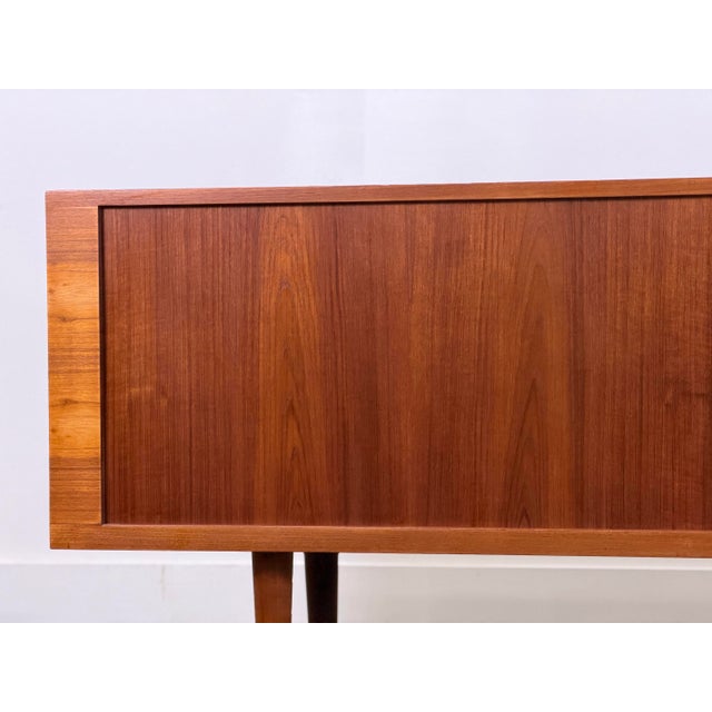 Hans J Wegner teak tambour door "President" credenza. Manufactured by RY Mobler, Denmark circa 1960s. Gorgeous old growth...