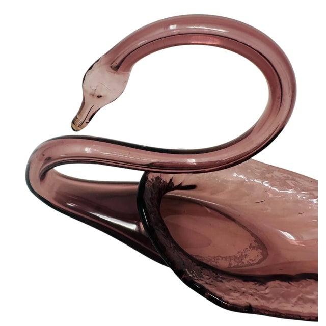 Bring a touch of timeless elegance to your home with this beautiful vintage amethyst glass swan bowl. This hand-blown art...