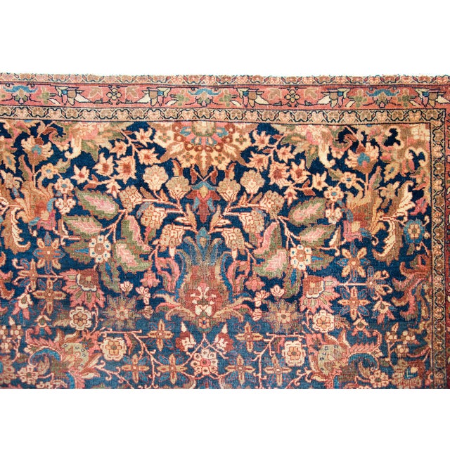 A stunning early 20th century Persian Meshkabad rug with an incredible patter with a large central floral medallion living...