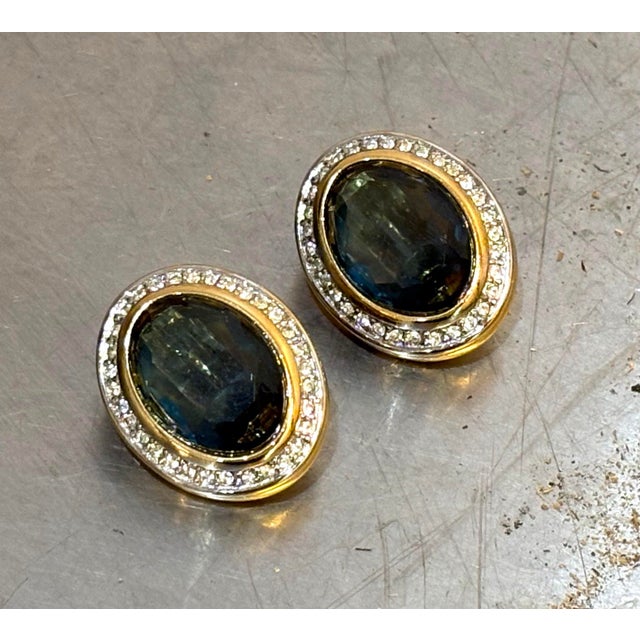 Nina Ricci 1970s-80s gold-tone/blue stone/rhinestone clip oval earrings. Marked at back as shown. Excellent condition.