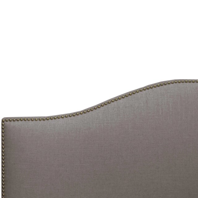 Give your interior a lift with this Upholstered Bed. Featuring the delicate curves of a classic camelback design, with...