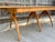 One of the all-time classic Heywood Wakefield pieces, the model M167G dining table. Extends from 28 inches to 94 inches...