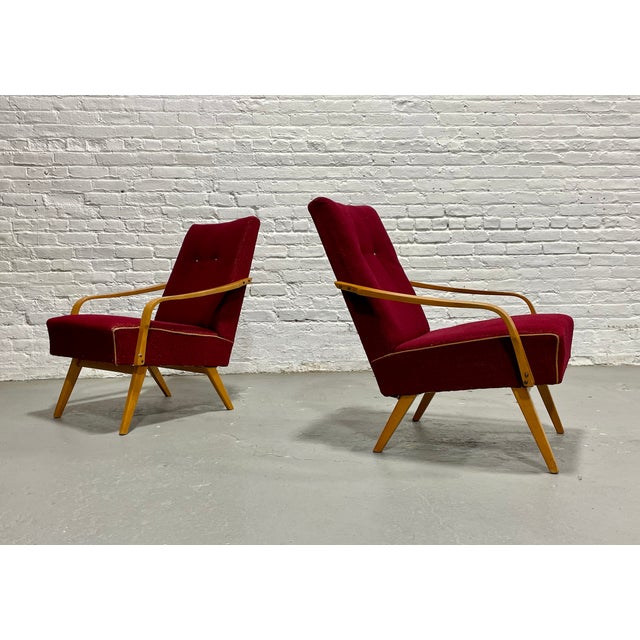 A striking pair of original lounge chairs, designed by Jaroslav Smidek, Made in Czechoslavakia, c. 1960s. These sculptural...