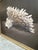 A striking large-scale painting by Gee Clay depicting a sculptural white coral formation rendered with remarkable realism...