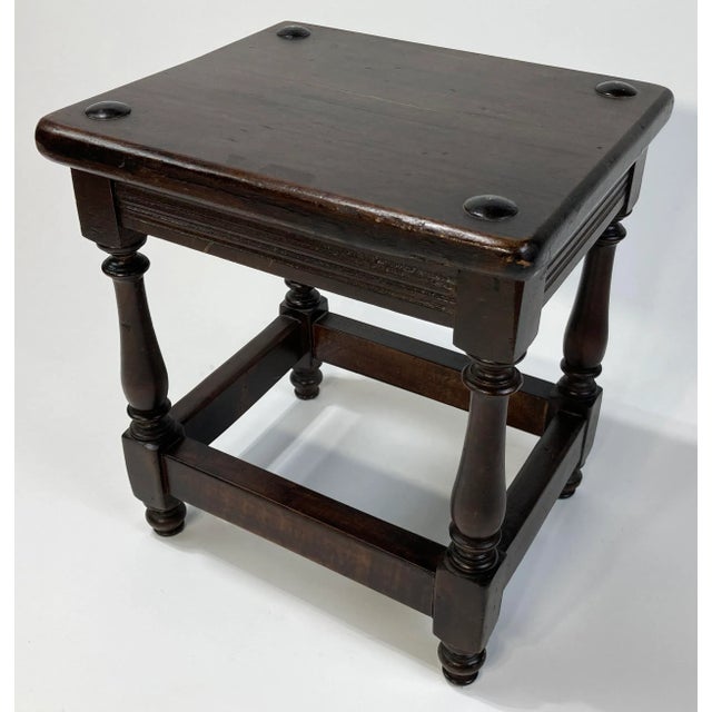 Antique English oak pegged joint stool with turned legs. Traditional British style. Block stretcher for stability and...