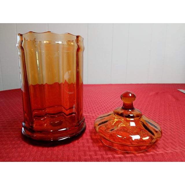 This vintage Mid Century Modern Empoli glass jar in Amber color, is unique and stylish addition to any glass collection....