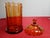 This vintage Mid Century Modern Empoli glass jar in Amber color, is unique and stylish addition to any glass collection....