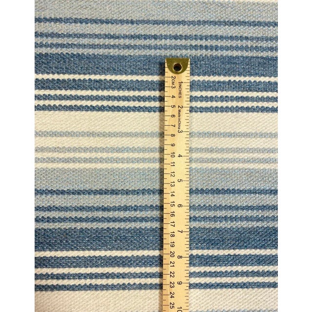 52” wide Cowtan + Tout water stain resistant Milas stripe upholstery fabric in blue French, aqua and cream. Price is per...