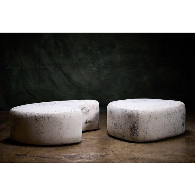 Custom contemporary ottoman set of 2 with organic bean-like forms and white upholstery with black abstract markings. -...