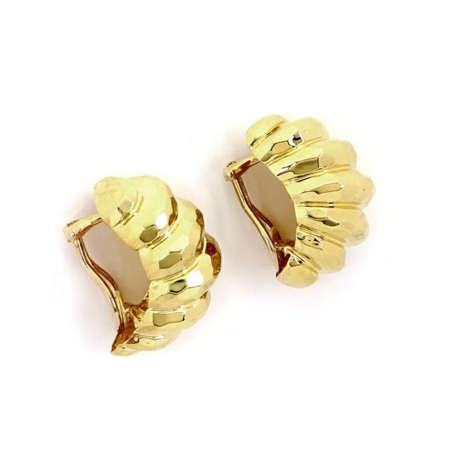 This is an eye catching authentic pair of earrings by Henry Dunay, the pair is crafted from 18k yellow gold featuring long...