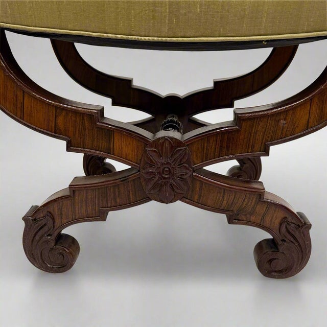 A fine single Neoclassical stool. X shaped base of mahogany with carved details on the legs.