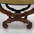 A fine single Neoclassical stool. X shaped base of mahogany with carved details on the legs.