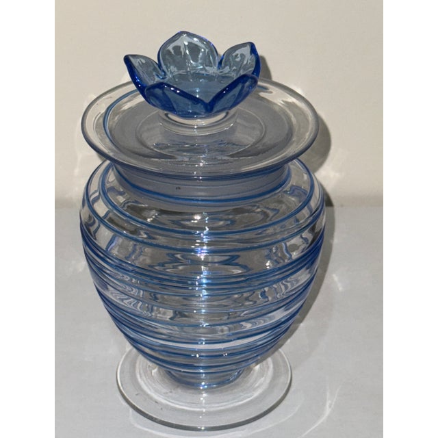 Finely blown at Steuben Glass Works during the golden years of the Carder period (1903–1932), this covered jar is...