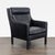 This Restoration Hardware lounge chair features a sleek black leather finish that adds a modern touch to any space. The...