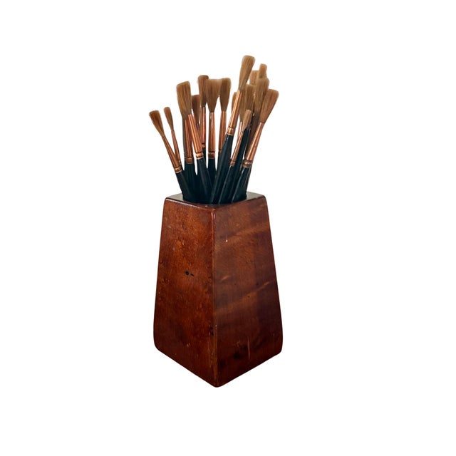 This handsome vintage hand-carved mahogany wood paint brush holder, stands 6.25” high X 3.5” wide and deep. The center...