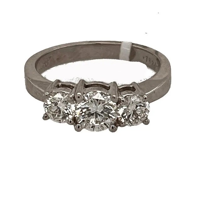 18kw Ring with GIA certified 0.75 carat G SI1 round and 2 rounds weighing 0.75 (total weight 1.50ct) 5.11g size 6.75