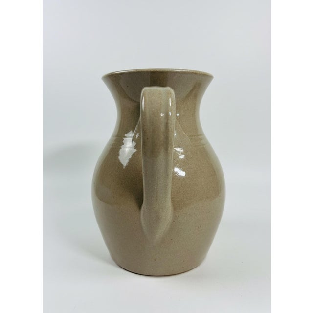 Vintage Jugtown Ware pottery pitcher, made in North Carolina and dated 1993. This substantial hand-thrown pitcher features...