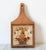 Vintage wood and tile cutting board trivet with floral motif. No maker mark. Some minor age wear.