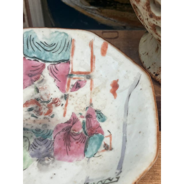 Classy Chinoiserie Dish with hand painted details of a daily scene. Details on the back of the plate as well. Beautiful...
