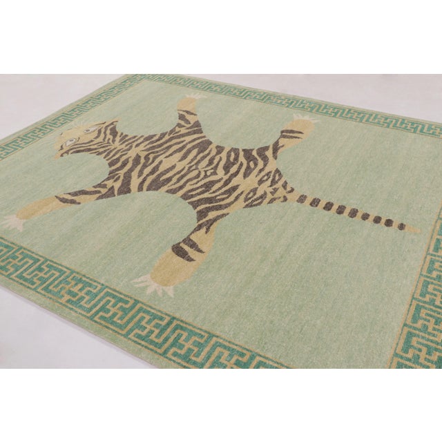 Hand-knotted in wool, this 8x10 rug is a striking new addition to our Distressed Homage collection, inspired by a mid-...