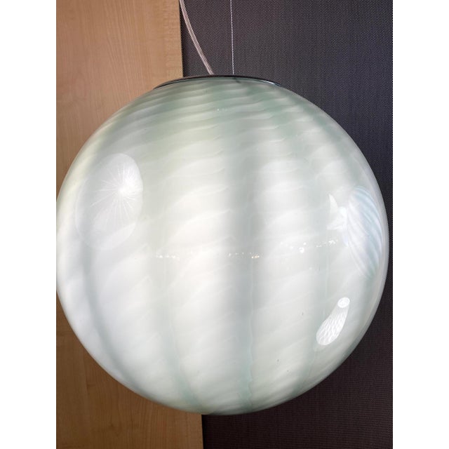 Impressive contemporary Milky-Green Sphere in Murano Glass Swirl. Design in very particular and effective movement. Very...