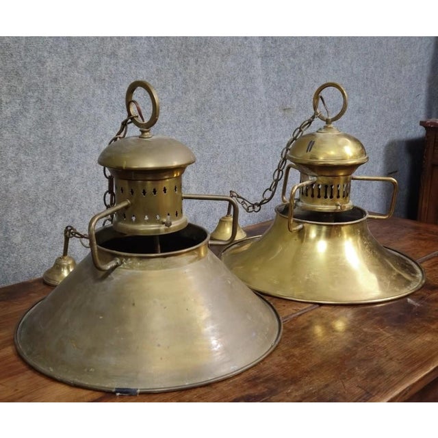 Pair of antique brass marine pendant lights with authentic charm and beautiful original patina. models with conical...