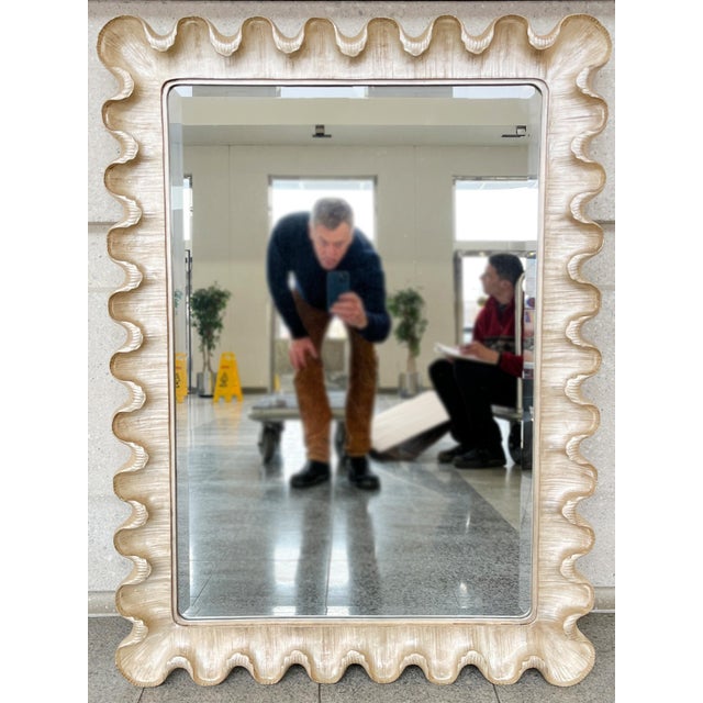 Crafted in the 1940s, this Italian wall mirror exudes Rococo whimsy and elegance. The frame is silver-leafed and scalloped...