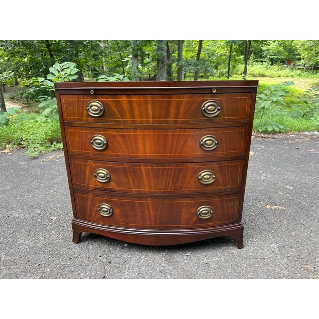 Baker Furniture Company Late 20th Century Georgian-Style Bowfront Flame Mahogany Chest of Drawers by Baker Furniture. For Sale - Image 4 of 17