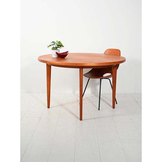 Swedish round teak extendable table from the 1960s with two extensions, produced by j.o. Carlsson vetlanda, with original...
