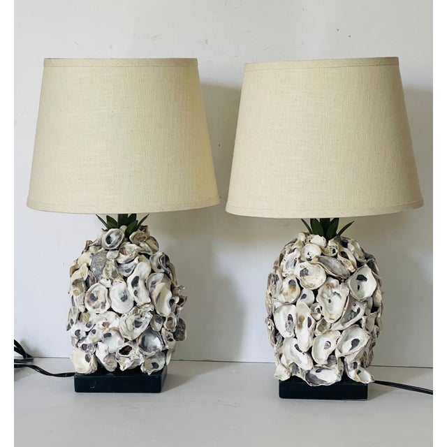 Gorgeous pair of grotto style oyster shells encrusted table lamps with custom decorated lamp shades.