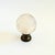 A vintage glass globe on a brass stand. Clear glass with frosted continents. Measures 3"Dia x 4.25"H