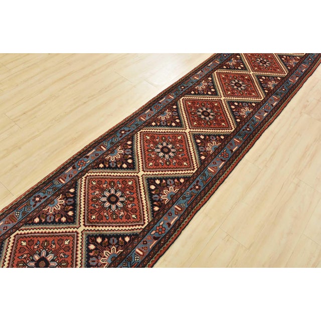 An authentic vintage traditional Roodbar runner hand-knotted with fine wool and natural dyes. This beautiful rug features...