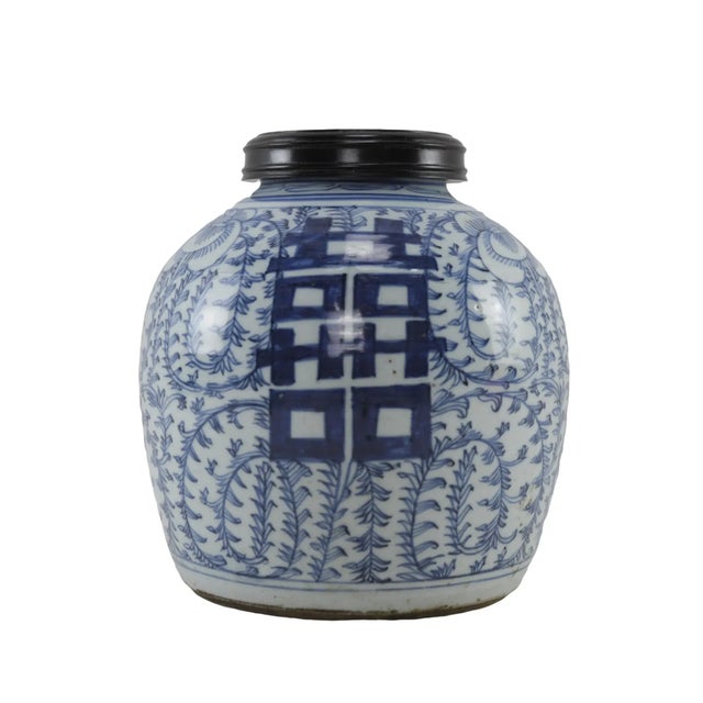 China mid-Qing blue and white porcelain ginger jar. The jar's body is decorated with cobalt blue underglaze flowers, with...