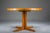 Elegant round mid-century dining table crafted in teak with a beautifully figured veneer. Professionally refreshed in our...